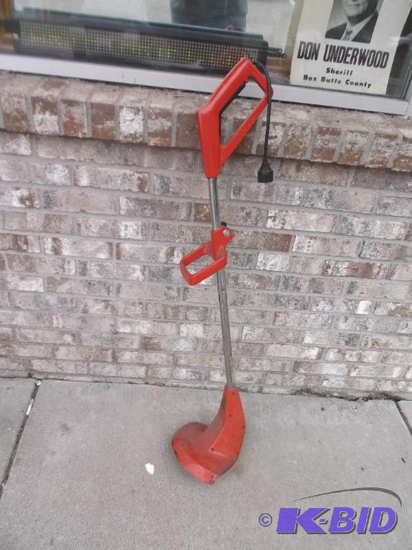 lot 23 image: Toro Weed Whipper, Works Fine, Needs Whip Wir...