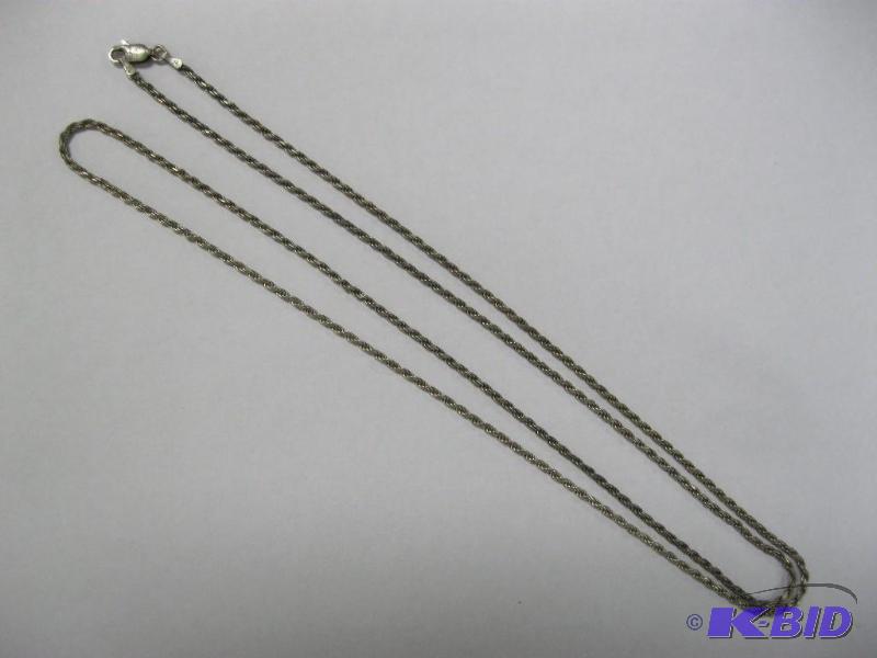 lot 86 image: Long Silver Tone Rope Necklace...