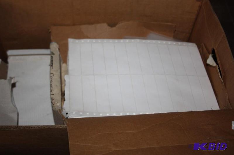 lot 295 image: Box of assorted label paper and plastic. Whit...