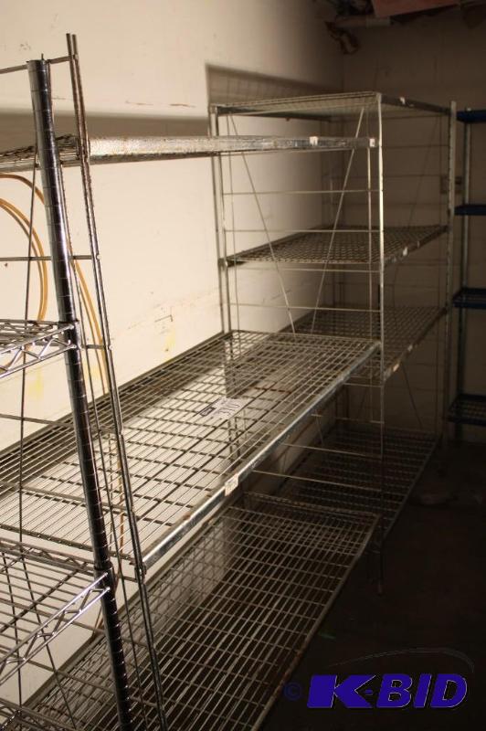 lot 310 image: Metal shelving unit 3 grate shelves. 24"...