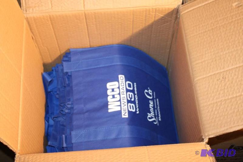 lot 44 image: Box lot of (4) Includes WCCO 830 tote bags. ...