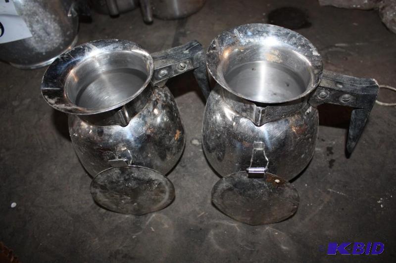 lot 555 image: Lot of (2) metal coffee pots for serving....