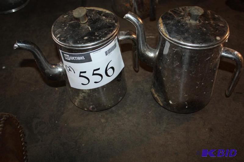 lot 556 image: Lot of (2) metal coffee pots for serving....