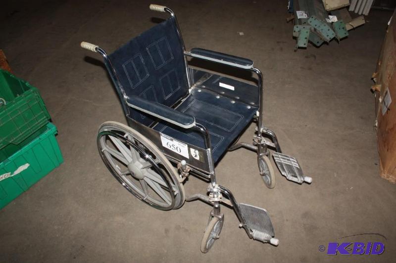 lot 650 image: Wheel chair metal frame blue vinyl backing....