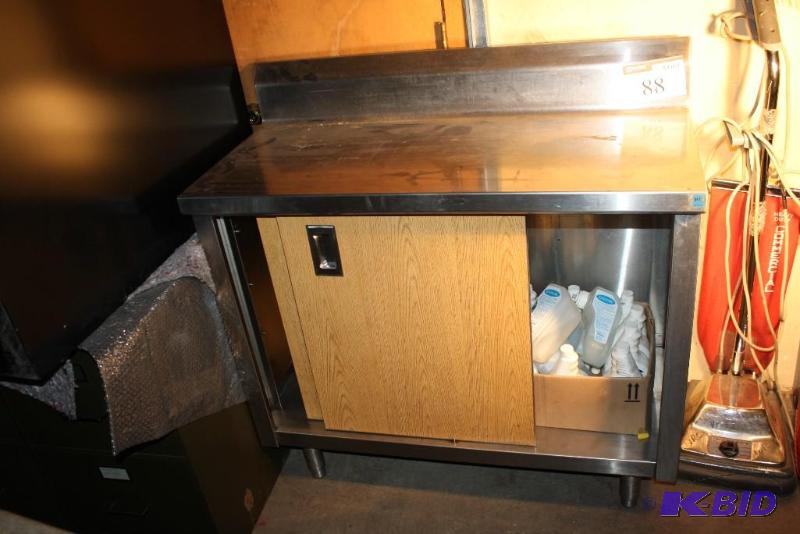 lot 88 image: Stainless steel table with storage and slidin...