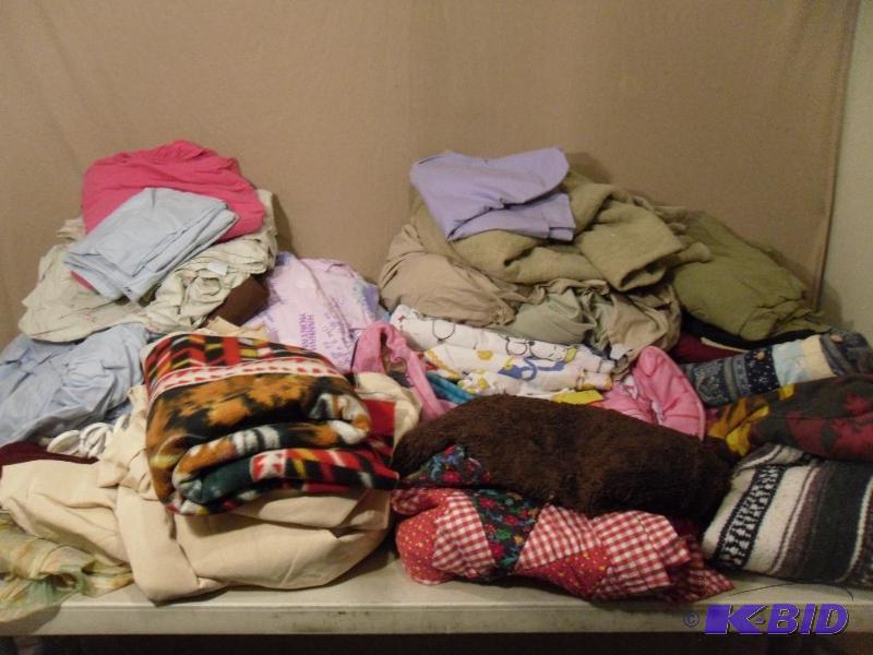 lot 121 image: Lot of Assorted Sheets, Blankets, and More. C...