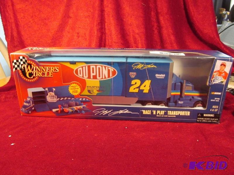lot 15 image: 1998 #24 Jeff Gordon Race N Play Transporter NIB