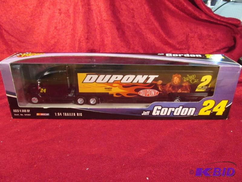 lot 21 image: 2004 Jeff Gordon #24 Dupont The Wizard of Oz 164 Transporter Action