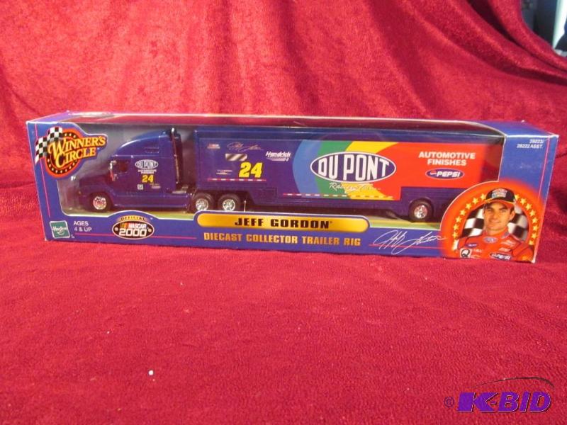 lot 23 image: 1999 Jeff Gordon #24 Dupont 164 Transporter Hasboro.