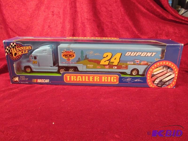 lot 25 image: 2002 Jeff Gordon #24 Dupont Monte Carlo 400 Rematch 164 Transporter Action.