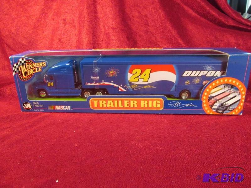 lot 26 image: 2002 Jeff Gordon #24 Dupont 164 Transporter Action.