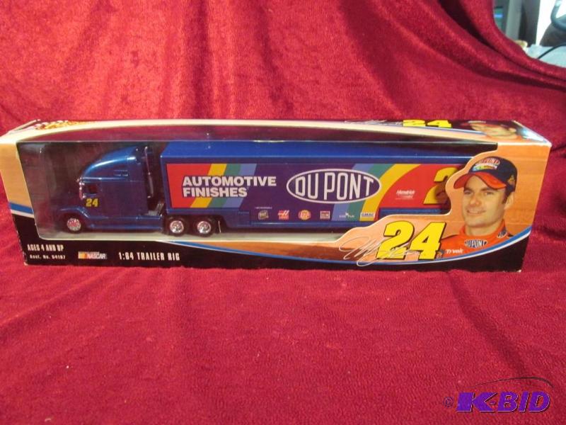 lot 32 image: 2004 Jeff Gordon #24 Dupont 164 Transporter Action