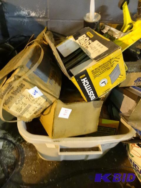 lot 216 image: Tub of misc air nails and staples...