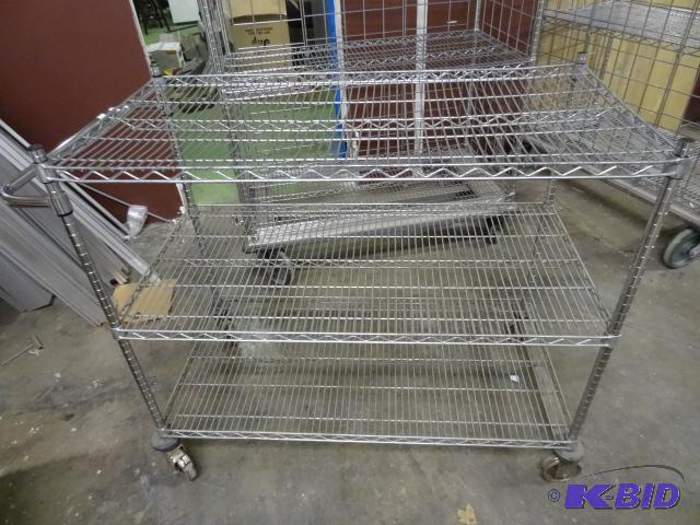 lot 271 image: Wire shelving cart. Rubber coming off wheels....