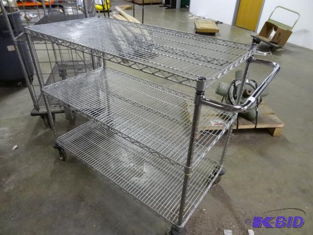 lot 272 image: Wire shelving cart. Rubber coming off wheels....