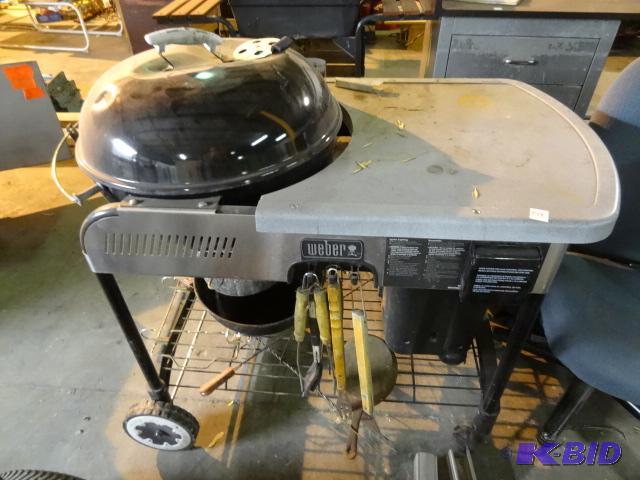 lot 278 image: Weber charcoal grilling station. Lid is dente...