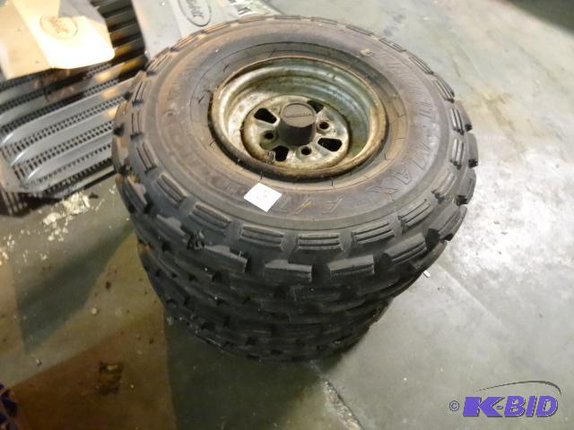 lot 293 image: 2 Honda 4 wheeler tires and rims. 20 x 7.00-8...