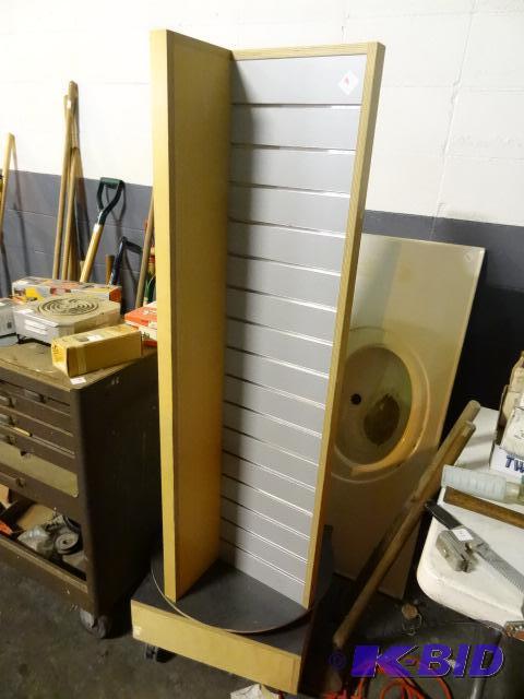 lot 334 image: Rotating slat wall display on wheels....