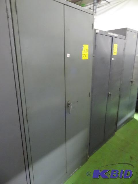 lot 34 image: 2 door metal cabinet. 4 shelves. 36 x 24 x 78...