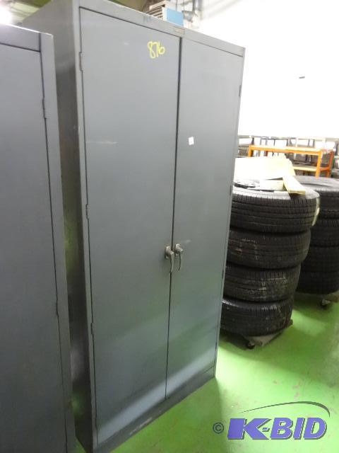 lot 36 image: 2 door metal cabinet. 4 shelves. 36 x 18 x 78...