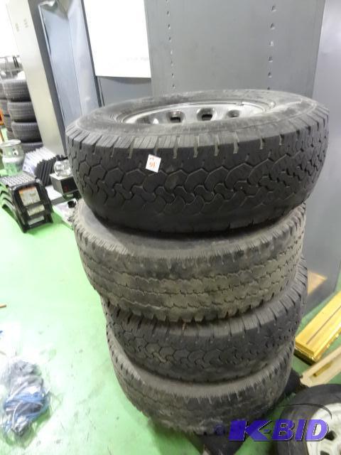 lot 54 image: 4 tires with steel rims. Came off a Ford F 35...