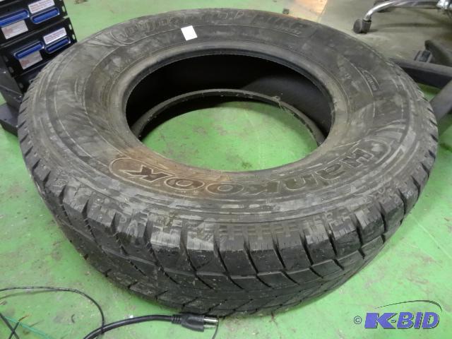 lot 65 image: 24570R16 tire. 7 ply. 50% tread...