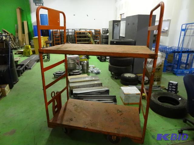 lot 66 image: Metal 2 tier cart with pull tounge. 55 x 30 x...
