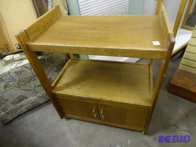 lot 75 image: Wood TV cart. 29 x 19 x 35...