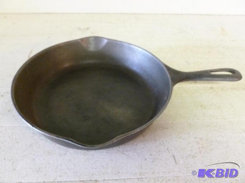 lot 69 image: Cast iron skillet pan that measures 9.5"...