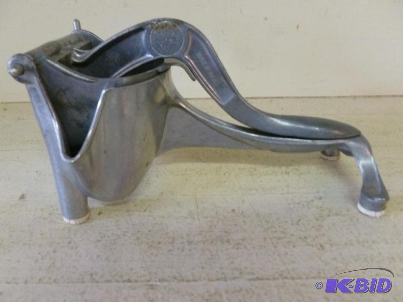lot 82 image: Large Wear Ever cast aluminum juicer that mea...