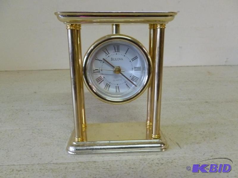 lot 92 image: Bulova&nbspmetal, battery operated clock....