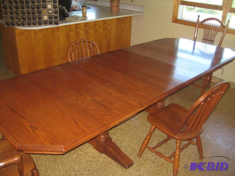 Table with Four Leaves and Four Chairs