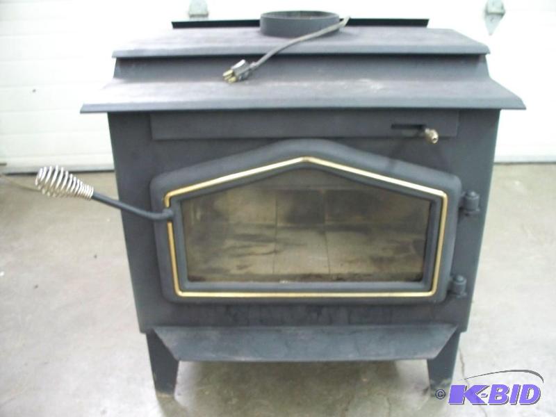 lot 2 image: Glass front wood burning stove. Nice shape...