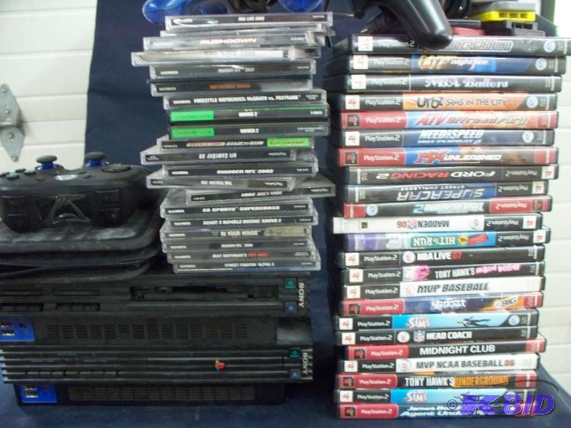 lot 32 image: 2-Playstation 2s  3 controllers  memory ca...