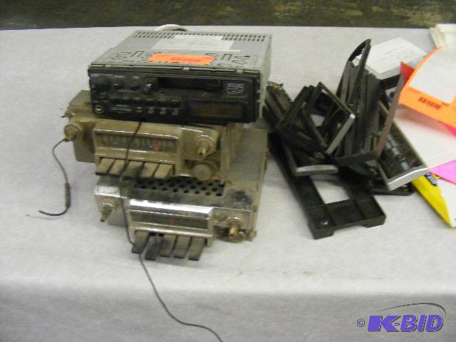 3 Radios, 2 unknown, 1 is an Optimus cassette...