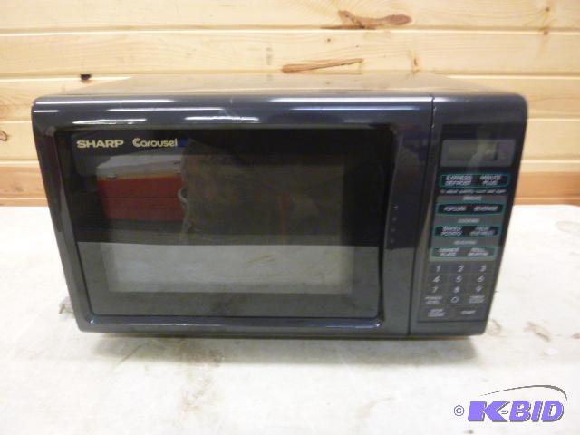 lot 110 image: GE Carousel Microwave Very good condition - t...