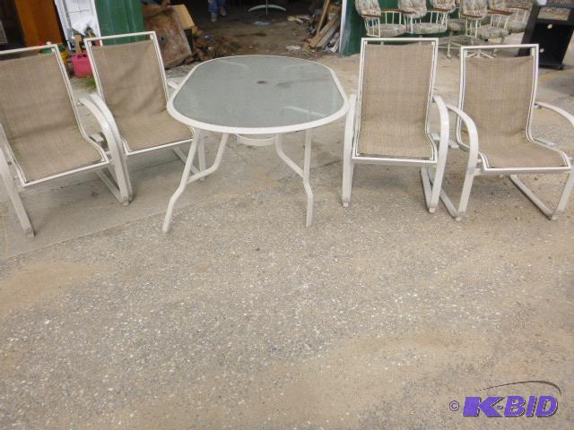 lot 132 image: Glass Top Patio Table with 4 Chairs One leg n...