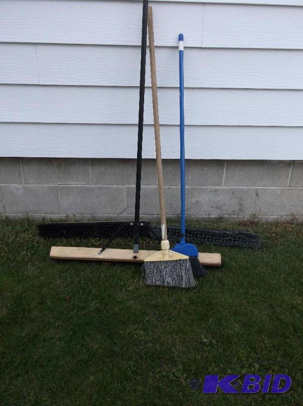 lot 31 image: Lot with 3 brooms & 2 broom heads all app...