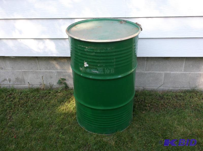 lot 40 image: Food grade 55 gallon metal barrel with lid &a...