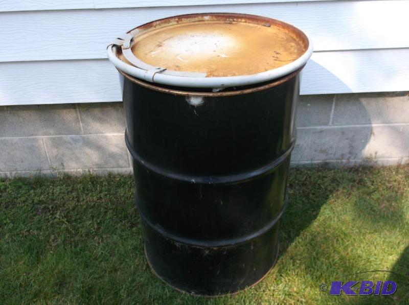 lot 43 image: Food grade 55 gallon metal barrel with lid &a...