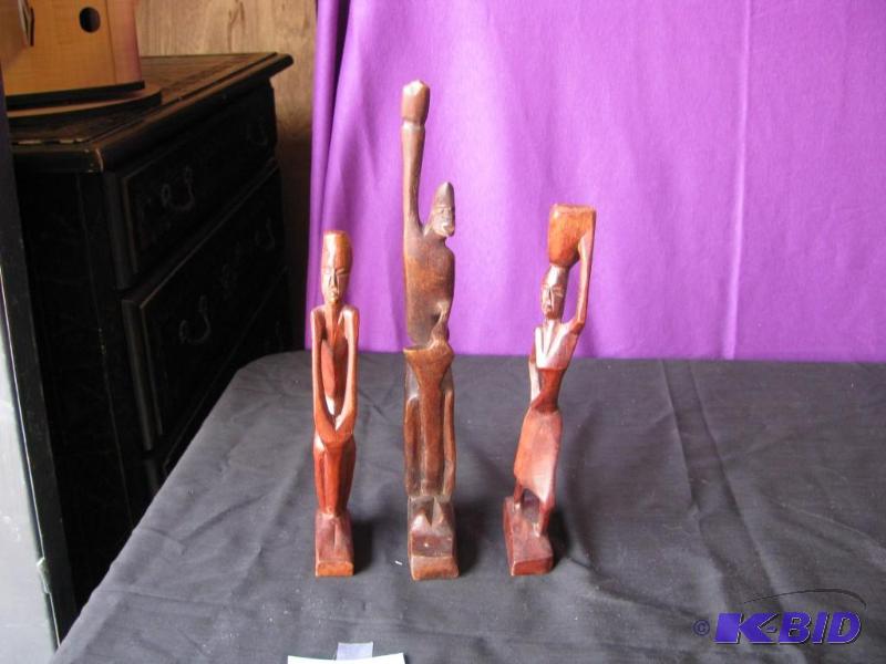 lot 64 image: three African wooden figurines made in Africa...
