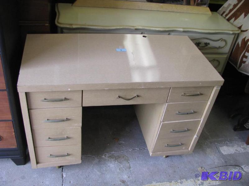lot 7 image: vintage 8 drawer formica finish desk. Solid a...