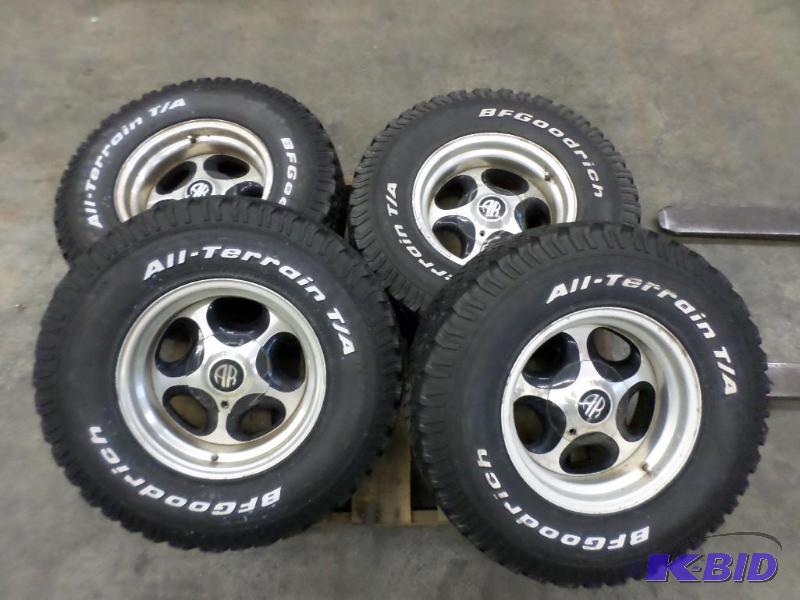 lot 11 image: (4) 6-Lug Wheels With BFGoodrich All Terrain ...