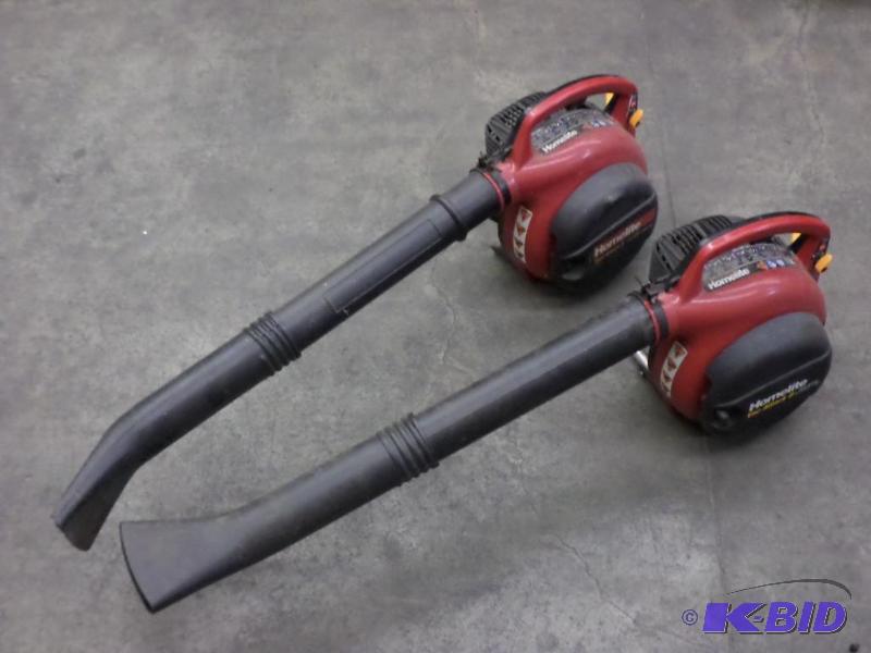 lot 59 image: (2) Homelite Gas-Powered Handheld Blowers For...