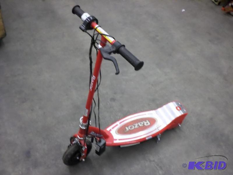 lot 67 image: Razor Electric Scooter With Charger Cord...