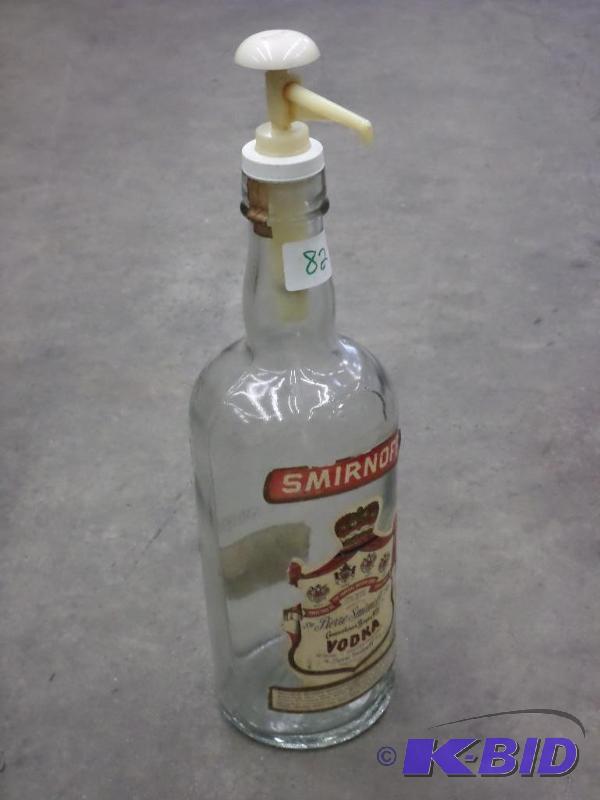 lot 82 image: Smirnoff 1-Gallon Glass Bottle With Dispensor...