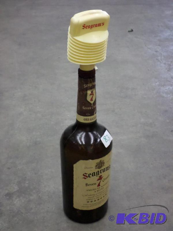 lot 83 image: Seagrams 1-Gallon Glass Bottle With Dispensor...