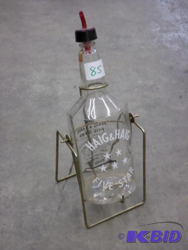 lot 85 image: Haig&ampHaig Glass Bottle With Stand...
