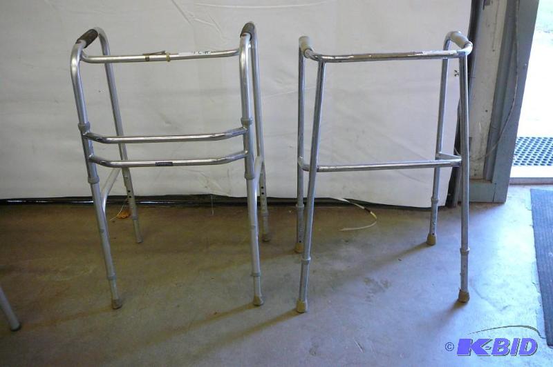 Aluminum walkers one with wheels and folds up...