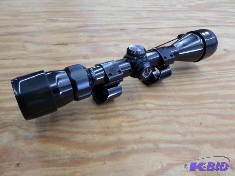 lot 1 image: Bushnell 3x9x40 Scope With Peek-Thru Scope Mo...